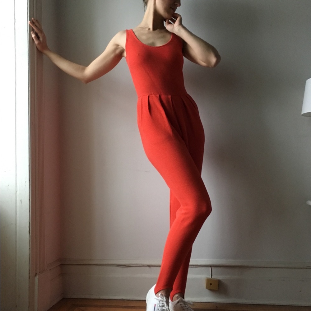 Bright orange jumpsuit with stirrups